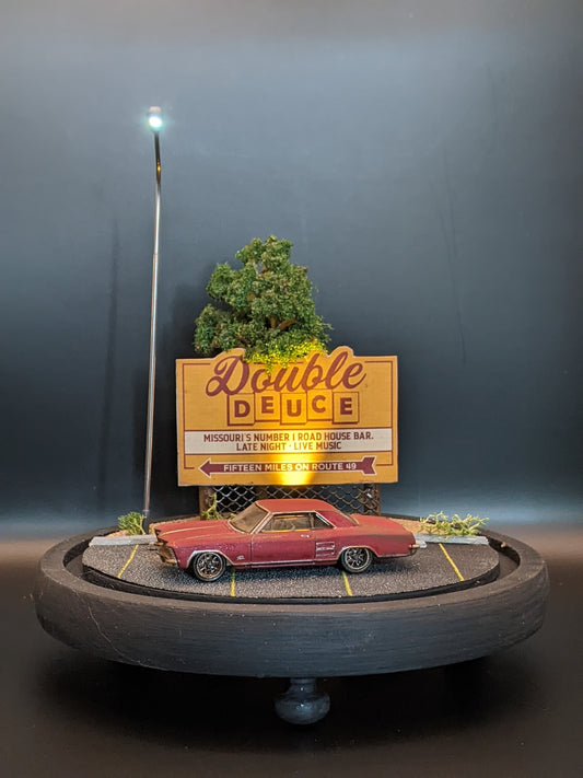 Handmade movie diorama lamp displayed under a glass bell jar with atmospheric lighting.