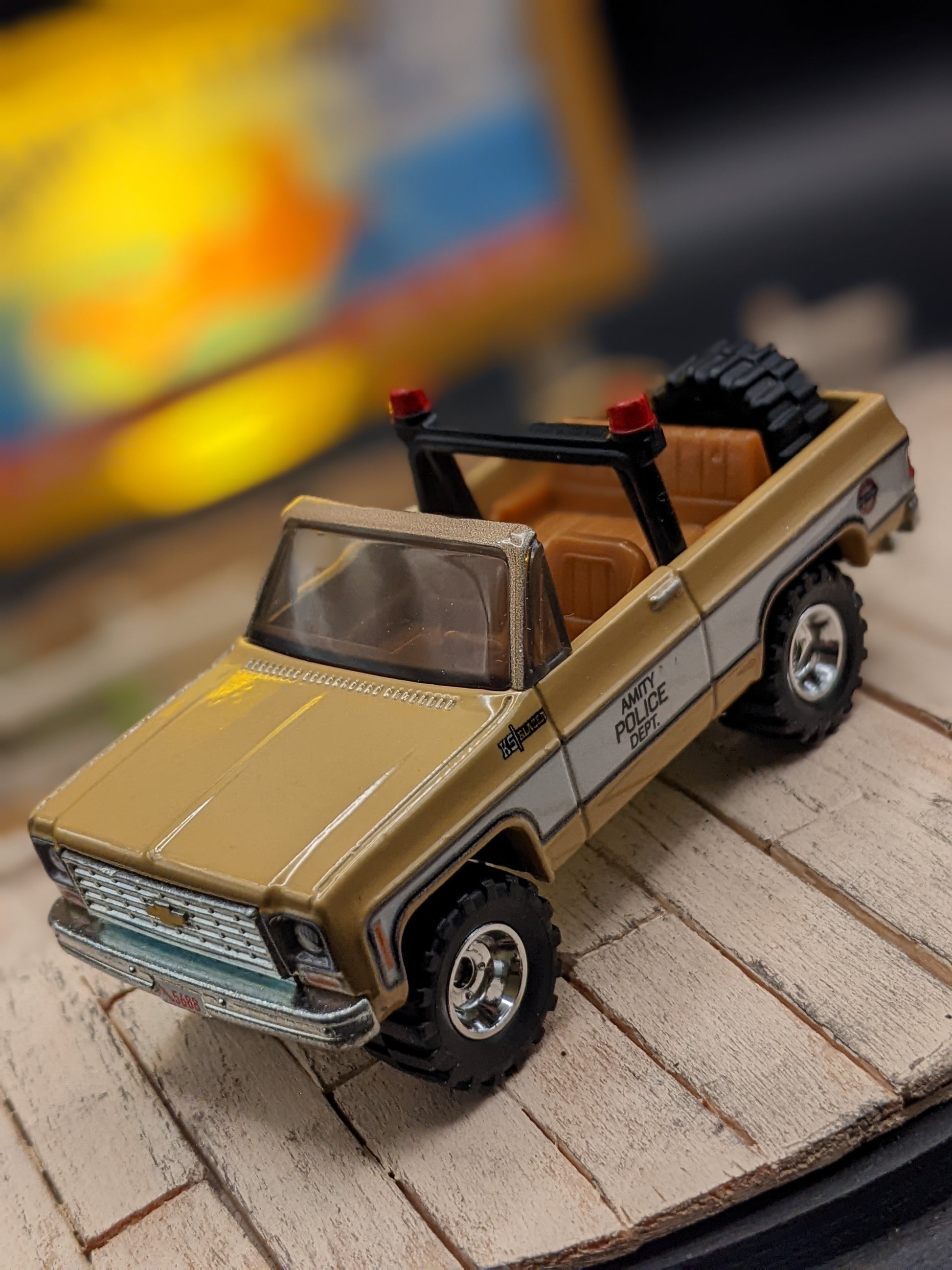 Close-up of 1:64 scale sheriff’s car in handmade movie diorama lamp.
