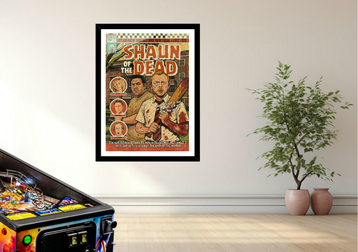 Framed 'Shaun of the Dead' poster on a wall next to a pinball machine and plants.